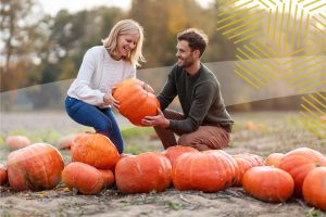 finding a pumpkin at an outdoor fall event