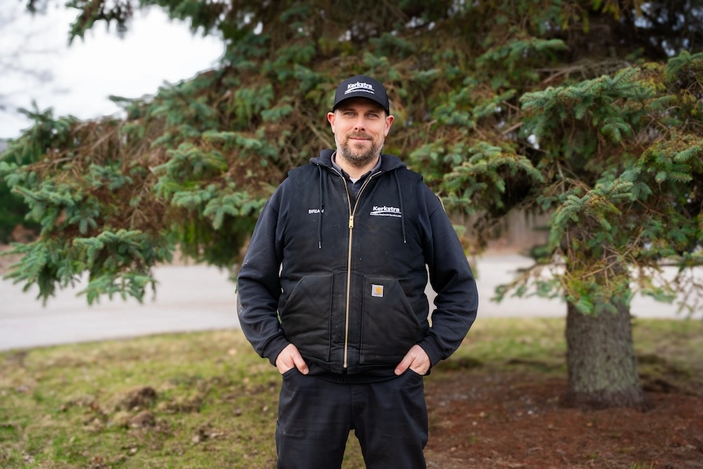 Brian from Kerkstra smiling in front of a tree